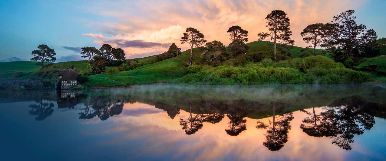 新西兰美丽迷人湖泊山脉带鱼屏壁纸