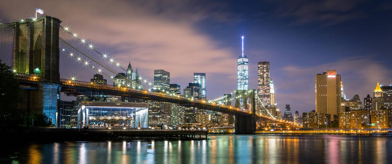 纽约金融区和华尔街大桥夜景带鱼屏壁纸